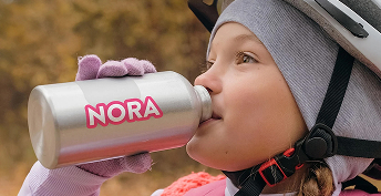 Child using water bottle with Sharkskin vinyl decal showing reliable adhesion